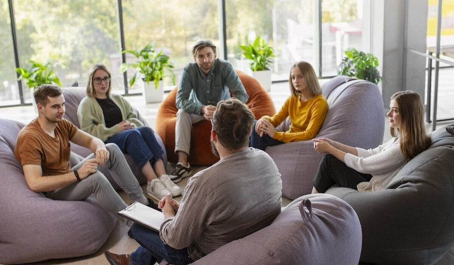 A team talking together during a wellbeing workshop